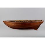 A wooden model of a boat hull, 35" long x 10 1/2" wide x 9" high