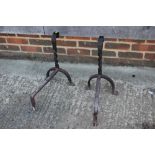 A pair of wrought iron fire dogs, 18" high