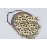 A beadwork evening purse with sterling silver mounts