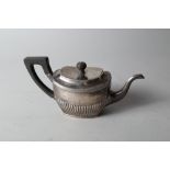 A Dutch 1st grade silver teapot with half-fluted body and ebonised handle, 13.1oz troy approx