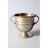 A silver polo cup/trophy with gadrooned border and engraving, 4 3/4" high, 13.2oz troy approx