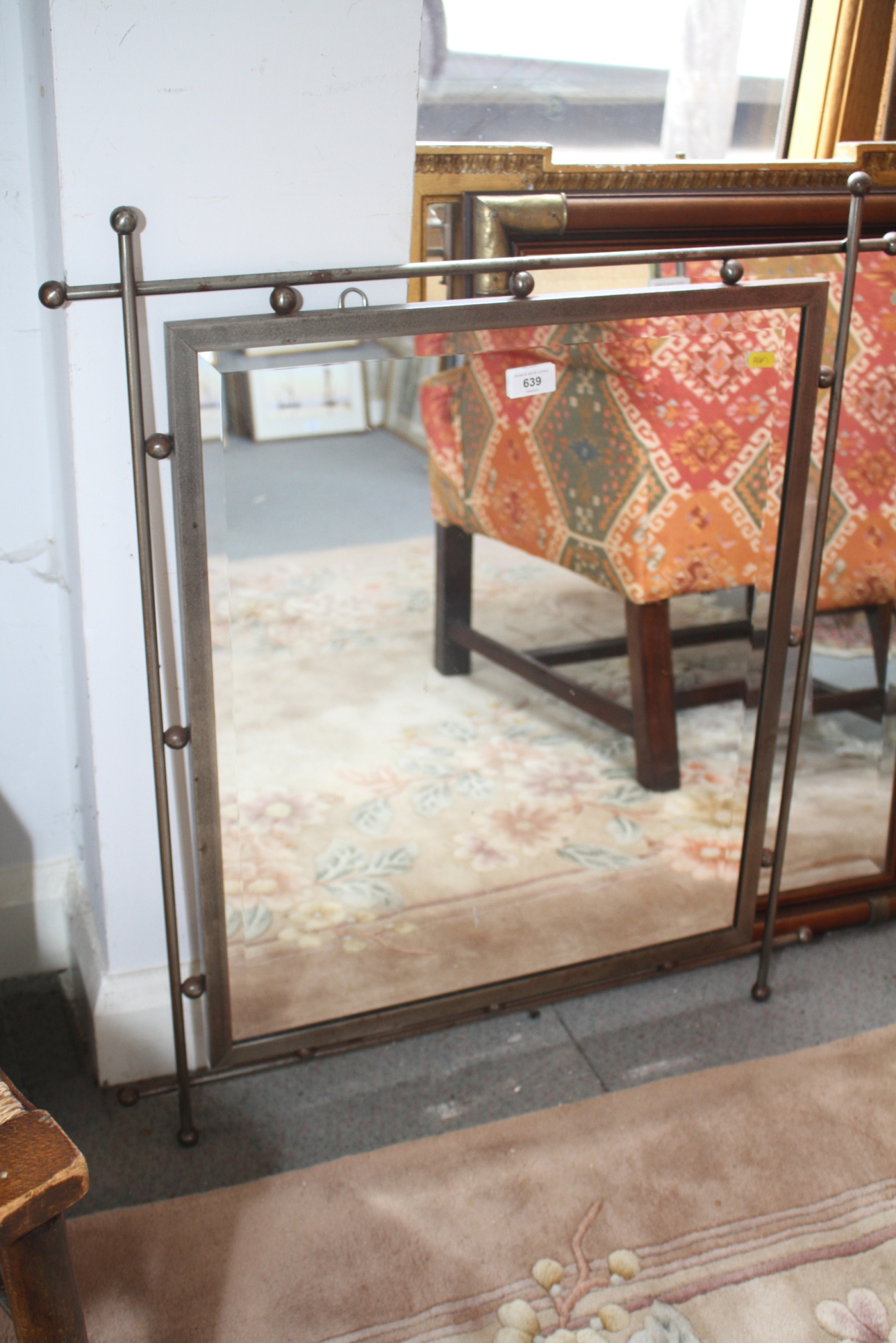 A wall mirror, in wrought iron frame, 23" square