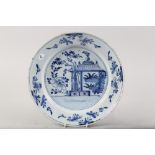 An early 18th century Dutch delft charger with building design, 13 3/4" dia (restored, has been in