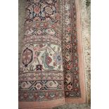 **A Herati carpet in shades of blue, red and natural with multi-borders, 200" x 156" approx **This