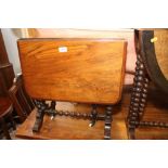 A 19th century figured walnut Sutherland table, on twin bobbin turned supports and splay feet, 21"