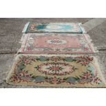 Three Chinese contour pile wool rugs, various designs, largest 36" x 60" approx