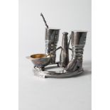 An 1877 Elkington silver plated cruet, formed as a pair of riding boots, hat, stirrup and riding