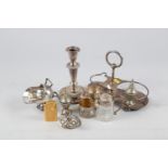 A silver plated candlestick, 6 3/4" high, a pair of silver plated pepperettes, a gold plated