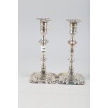 A pair of Georgian style silver candlesticks with filled bases, 10" high