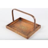 An early 19th century rosewood and brass inlaid tray with carry handle over, 10" wide