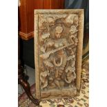 An Indian hardwood carving of Saraswati with acolytes, 35" x 17 1/4"