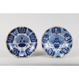 A pair of late 18th century Dutch delft "Peacock" pattern plates, 9" dia, one with "arrow" mark