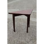 A 19th century mahogany and floral marquetry triangular fold-over top collapsible card table, on