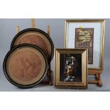 A pair of 19th century Bartolozzi circular sepia prints of figures and cherubs, in Hogarth frames,