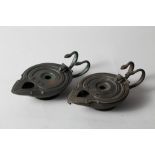 A pair of bronzed "Roman" oil lamps with twin serpent handles, 7" wide