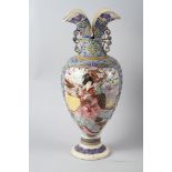 An early 20th century Japanese polychrome enamel two-handled vase with flared rim, 21" high