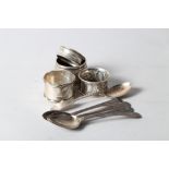 A set of four Georgian silver teaspoons, another silver teaspoon, three silver napkin rings and