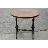 A late Victorian figured walnut oval occasional table, on spiral turned and splay supports, 28" wide