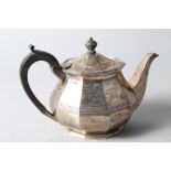 A silver ten-sided teapot with ebonised handle and knop, with engraving, 22.3oz troy approx