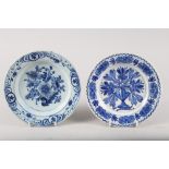 A mid 18th century London delft plate with vase of flowers design, 9" dia, and a mid 18th century