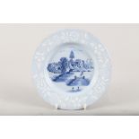 A mid 18th century Bristol delft bianco sopra bianco plate with fisherman centre, 9" dia (restored