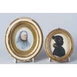 A miniature portrait of an elderly woman, in oval frame, and a silhouette of a young girl with fur