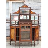 A late 19th century rosewood and inlaid break bowfront display cabinet, fitted mirrors over glazed