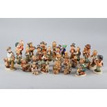 A collection of approximately thirty Hummel figures, mostly post-war musicians and choristers