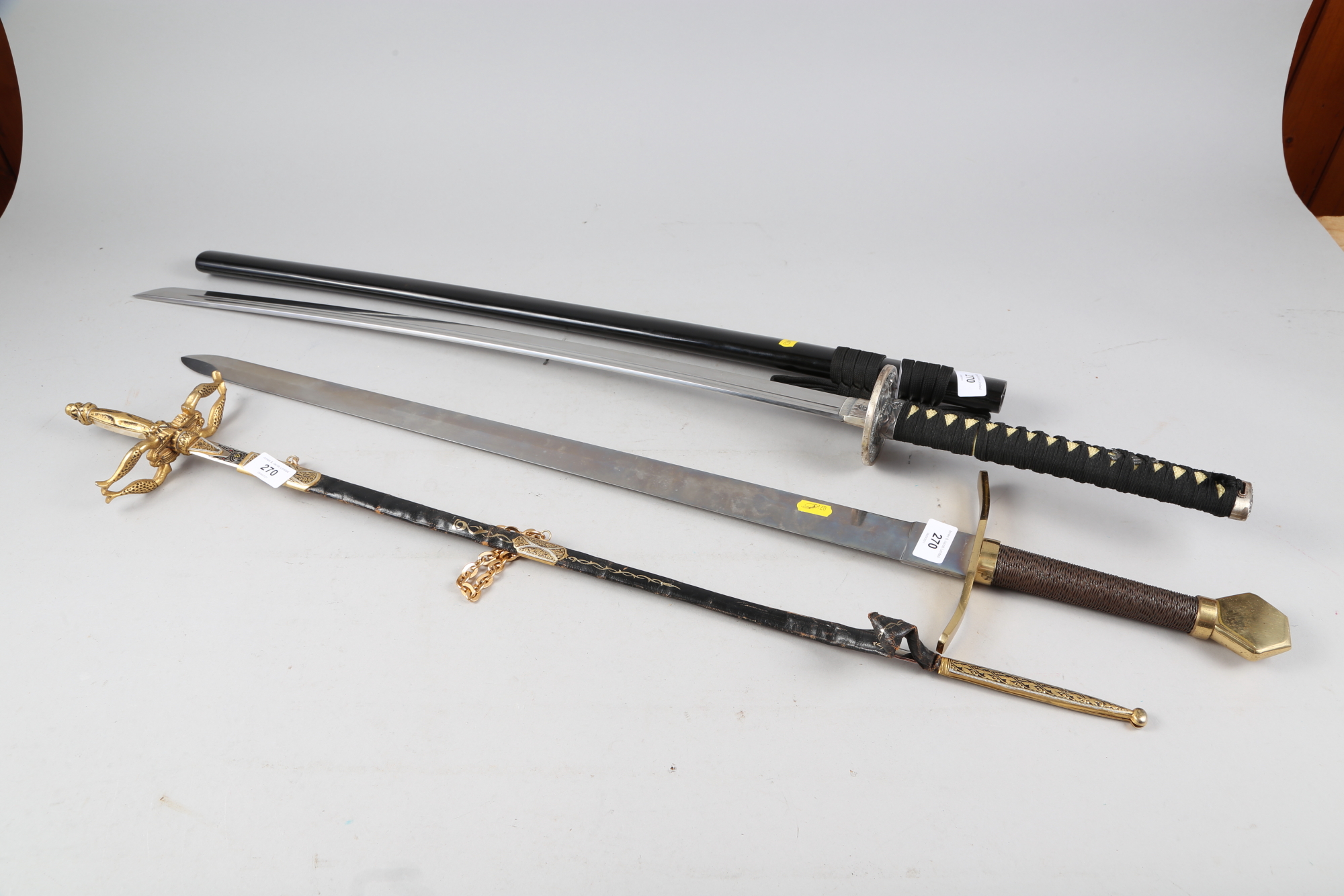 A Japanese Katana, in black plastic scabbard, blade 27 1/2" long, a modern Crusader's sword, a