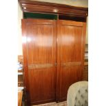 A 19th century mahogany and line inlaid two-door wardrobe with four internal drawer and three