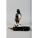 A Royal Doulton "Old Crow" bottle, 12 3/4" high, and a silver Crane Company Parker Fountain pen desk