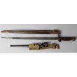 An American 1917 Remington bayonet with metal and leather scabbard, blade length 16 3/4" long, and