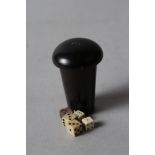 An early 19th century turned and ebonised dice cup and cover, together with five dice, cup 2" high