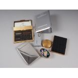 An assortment of metal pill boxes, a cigarette case, a pocket calculator and mixed brassware