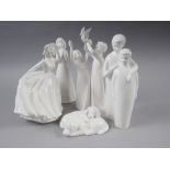 Five Royal Doulton white china figures, a Lladro figure of a child and two similar Nao figures