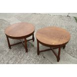 A pair of mahogany parquetry top oval occasional tables, on reeded supports, 26" wide x 23" deep x