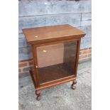 A mahogany glass fronted cabinet, on cabriole supports, 21 1/2" wide x 14 1/2" deep x 28 1/2" high