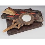An artist's mahogany travelling paint box, a lacquered carved wooden tray and a hand mirror, in
