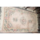 Three Chinese contour pile rugs with floral centres, 60" x 36" approx