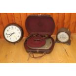 A Telefunken portable record player in Bakelite case, a similar wall clock and a mantel clock