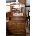 An early 20th century Swiss walnut bedroom suite, comprising wardrobe enclosed mirror door, 44"