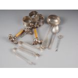 Assorted silver items, including three napkin rings, a Georgian fiddle pattern sauce ladle, a pair