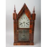 A late 19th century American mahogany arch top case mantel clock with eight-day striking movement,