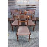 A set of six Regency style mahogany bar back dining chairs with drop-in seats, upholstered in a