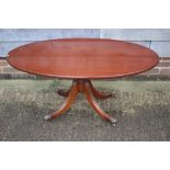 A mahogany low oval occasional table, 48" wide x 27" deep x 21" high