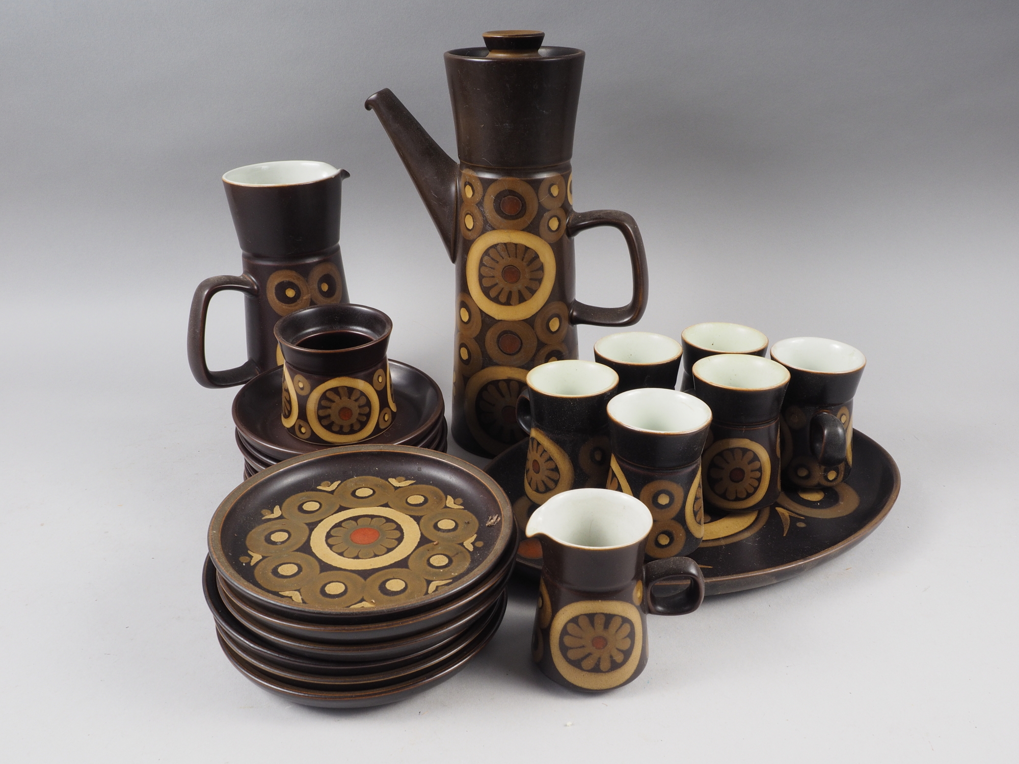 A 1970s Denby "Arabesque" pattern brown glazed coffee set (coffee pot lid damaged)