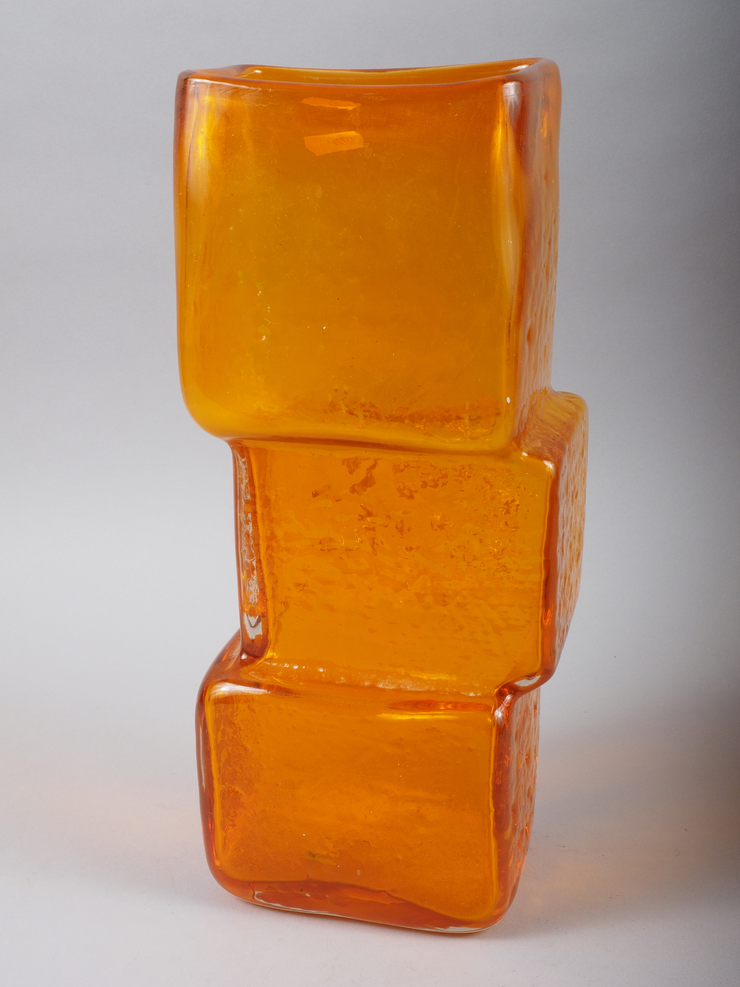 A Whitefriars orange coloured "Drunken Bricklayer" vase, 13" high