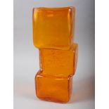 A Whitefriars orange coloured "Drunken Bricklayer" vase, 13" high