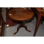 A 19th century mahogany circular tilt top occasional table, on turned column and tripod splay