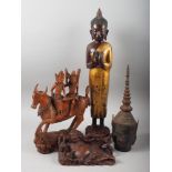An Oriental lacquered figure of a standing Buddha with gilt robe, 21" high, a Thai metal deity's